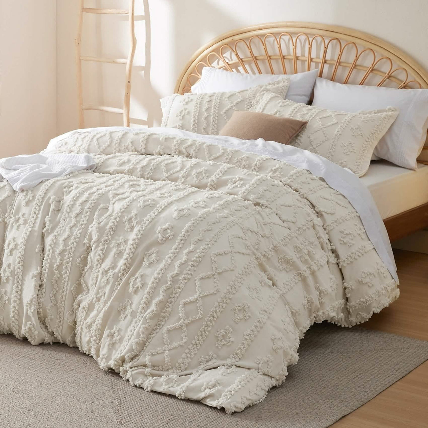 White tufted boho bedding styled on a rattan bed